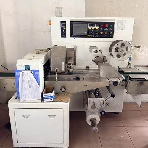 Automatic tube wrapping machine applying protective foam to shower chair edges