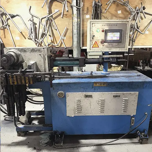 Tube bending machine shaping aluminum for ergonomic handrail curves