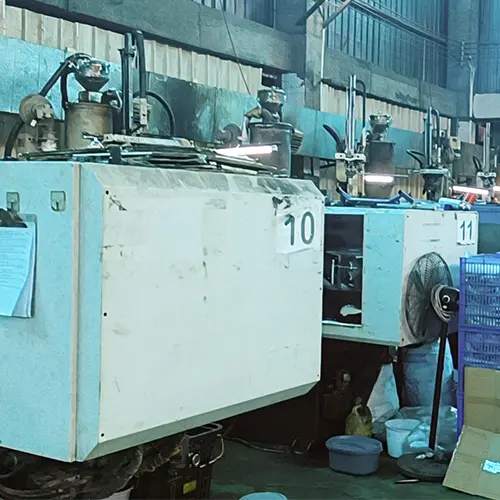 Injection molding machine producing plastic seat for shower chair at Dinglian rehabilitation equipment factory