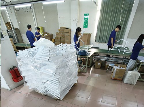 Technicians assembling rehabilitation equipment on Dinglian’s main production line