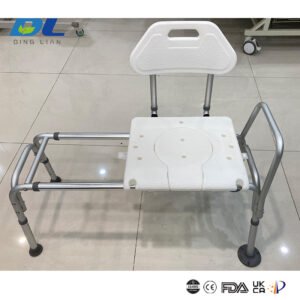 A tub transfer bench securely placed inside a bathtub, with an elderly person demonstrating safe side-transfer onto the seat.